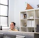 Smiling engineer reviewing product designs in a modern offshore manufacturing facility.