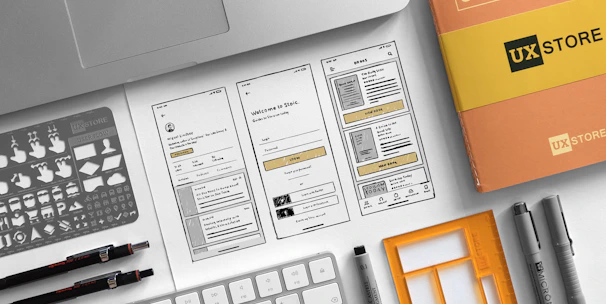 Industrial designers sketching product concepts with prototypes and tools around.