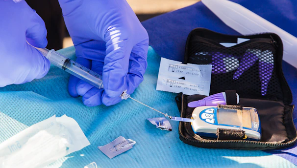 Close-up of hands exchanging a high-quality diagnostic product package.